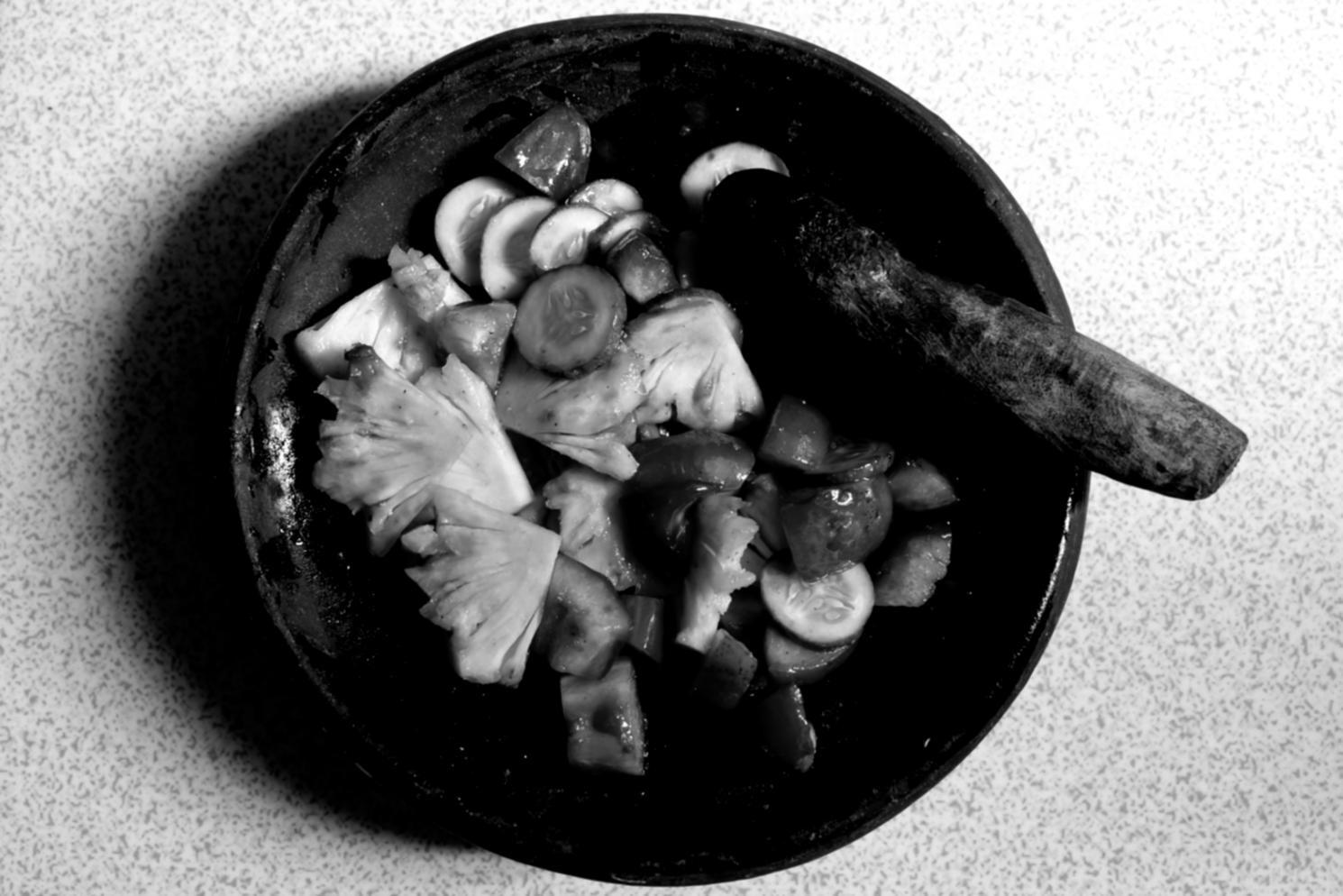 Hands-on culinary instruction session showing traditional cooking techniques