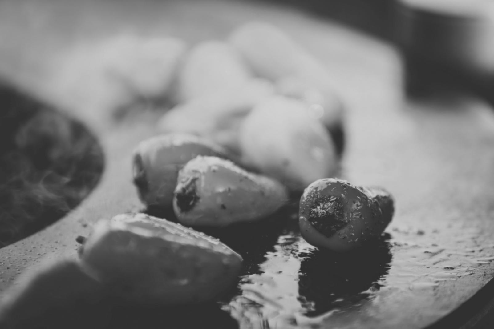 Professional kitchen team collaborating on ethnic cuisine preparation